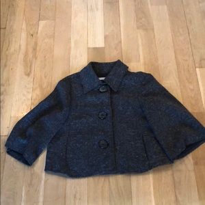Tweed capelet.